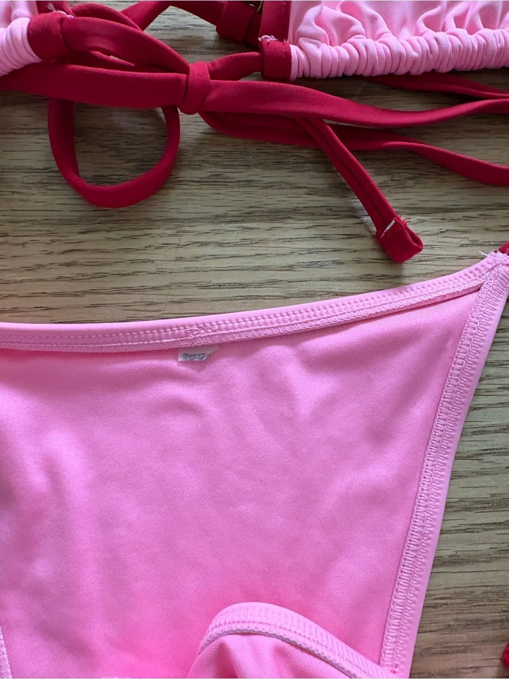Frankie’s Bikinis Pink Triangle Bikini Set with Red Trim